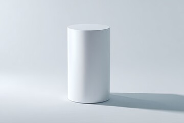 Blank white cylinder pedestal on a plain white background
