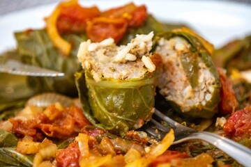 Authentic Ukrainian food known as holupti, cabbage or kale leaves stuffed with rice and ground meat
