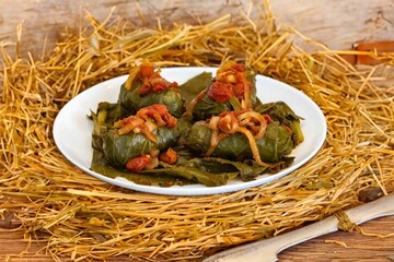 Authentic Ukrainian food known as holupti, cabbage or kale leaves stuffed with rice and ground meat
