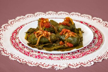Authentic Ukrainian food known as holupti, cabbage or kale leaves stuffed with rice and ground meat