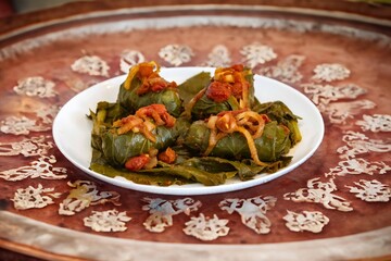 Authentic Ukrainian food known as holupti, cabbage or kale leaves stuffed with rice and ground meat