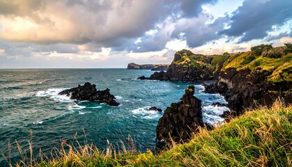 Coastal view of dark volcanic rocks and turbulent ocean