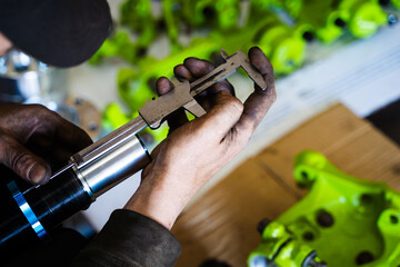 Measuring Coilover before installing on drift car project. Adjusting coilover height and preload with micrometer precision ensures optimal balance and weight distribution on purpose-built drift car.