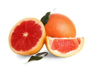 Cut fresh grapefruits and leaves on white background