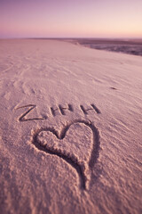 Z and H Initials Naturally Sketched into Smooth Beige Sand with Minimalist Romantic Glow – perfect for wedding keepsakes