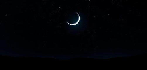 Naklejka premium Silvery crescent moon hangs low over a dark, star-studded landscape, night scene, peaceful