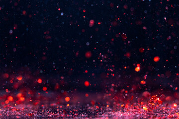 Obraz premium Vibrant red and blue particles floating in a dark atmosphere during a celebration