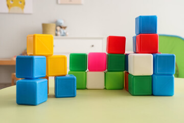 Colorful cubes on table in children's bedroom, closeup
