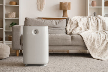 Modern air purifier on carpet in living room