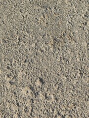 asphalt road construction has some smooth parts and holes, portrait shots