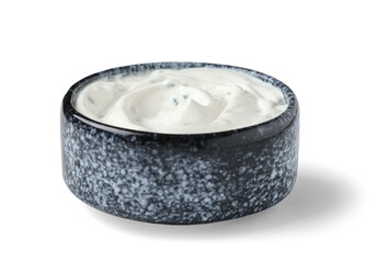 Bowl with tasty sour cream and chopped greens on white background