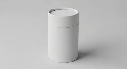 A cylindrical, white container with a lid, casting a subtle shadow on a neutral background.