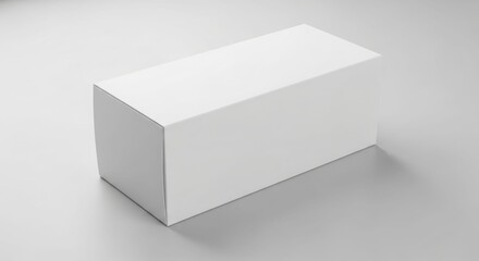 Fototapeta premium A plain white rectangular box sits on a light gray surface, casting a soft shadow.