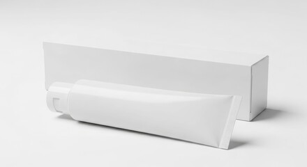 Blank white toothpaste tube and box on a plain white background.