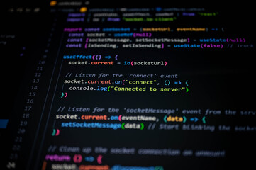 Close-up of colorful JavaScript code on computer screen, showing socket connection and server communication for modern web development, programming workflow, and digital technology concept.