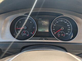 Car dashboard with speedometer tachometer and digital display