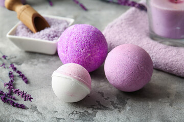 Composition with lavender bath bombs on grey grunge background, closeup