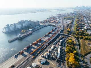 Aerial view of port industrial tanks and container yard near river in Montreal, Canada. g.