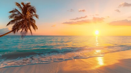 Majestic golden sunrise over tranquil sea waves with a single palm tree standing on the beach
