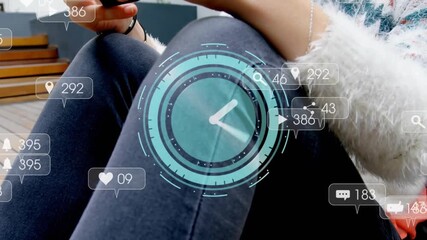 Woman on deck tapping smartphone with clock and icons appearing tracking social media engagement - Powered by Adobe