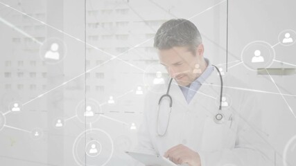 Doctor focusing on tablet screen and generating floating patient icons for mapping medical network - Powered by Adobe