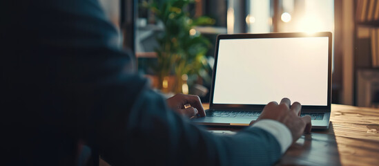 Focusing on the Details: A focused individual, hands poised over the keyboard of a laptop, showcasing the digital sphere