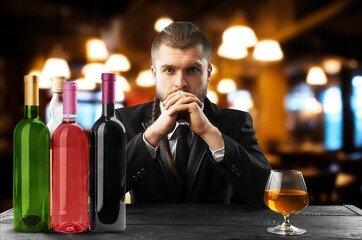 Young hipster male with beard and alcohol.