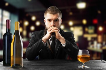 Young hipster male with beard and alcohol.