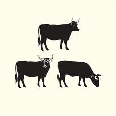 Vector art of three black silhouette highland cattle isolated on a cream background