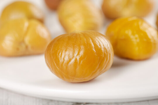 Peeled Chestnuts Ready to Eat - Golden Kernel Nuts on White Plate