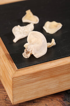 Dried White Ear Mushrooms Changbaishan Specialty Fungus Ingredients on Slate Board