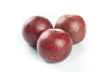 Fresh Red Australian Rouge Plums Imported Stone Fruit on White Background