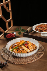 Smoked bacon with roasted bamboo shoots - traditional Asian braised dish on wooden table