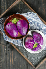 Purple Potatoes in Rustic Bowls on Wooden Tray with Mint Garnish - Healthy Vegetarian Food Display