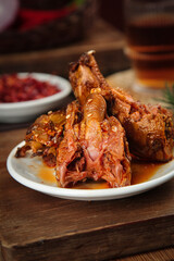 Spicy Chengdu rabbit head dish traditional Sichuan Chinese cuisine marinated with vegetables and sauce
