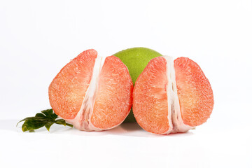 Fresh Pink Pomelo Citrus Fruit Segments with Green Peel and Mint Leaf on White Background