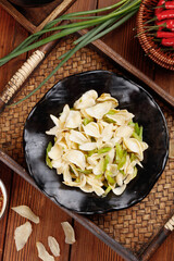 Sauteed Fresh Lily Bulbs and Celery Main Dish in Traditional Asian Kitchen Setting