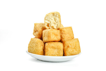 Deep-fried golden tofu cubes on white plate - delicious Asian vegetarian protein food