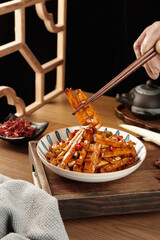 Asian cuisine sautéed bamboo shoots with bacon sauce mushrooms asparagus chopsticks traditional dining