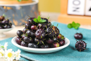 Fresh Wild Water Chestnuts from Yunnan China with Mint Garnish on Turquoise Table