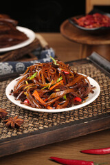 Sauteed Kelp Noodles with Shredded Vegetables and Peppers on Rustic Wooden Table