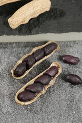 Black Peanuts Yunnan Selenium-Enriched Variety in Shells on Stone Surface Healthy Legume Crops Grains Cereals