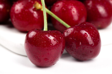 Fresh Red Cherries with Water Drops on White Background