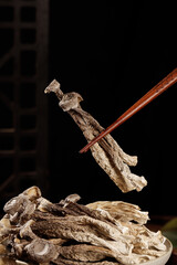 Dried Mushrooms with Wooden Chopsticks - Natural Food Ingredients and Cooking Preparation