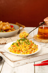 Yangzhou Fried Rice with Egg - Traditional Chinese Golden Rice Dish on Wooden Serving Board