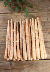 Fresh White Yam Roots Bundled on Rustic Wood Background with Green Leaves Farm Harvest Organic Vegetables Natural Food Photography