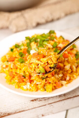 Yangzhou Fried Rice with Mixed Vegetables and Scrambled Eggs on White Plate