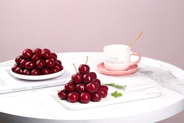 Fresh Chilean Black Pearl Cherries with Coffee on Marble Table - Gourmet Food Styling