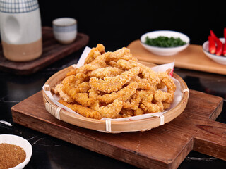 Crispy Pork Rinds on Bamboo Plate - Traditional Fried Snack Food with Asian Style Presentation