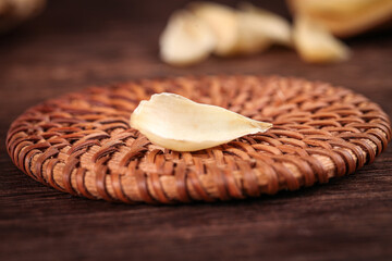 Fresh White Garlic Clove on Wicker Basket Mat Closeup - Natural Cooking Ingredient